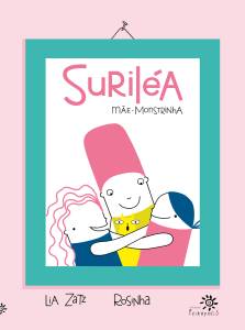 Capa do livro Suriléa, mãe-monstrinha, com fundo rosa-claro e moldura verde-água simulando um quadro pendurado. No centro, uma ilustração simples e colorida mostra três personagens abraçados com expressão feliz: uma figura central com corpo branco e cabelo alto rosa (Suriléa), abraçada por duas crianças, uma de cabelo rosa ondulado e outra de cabelo azul liso. Um pequeno gato amarelo aparece no meio do abraço. O título está em letras grandes rosa na parte superior e o subtítulo “Mãe-monstrinha” em letras pretas desenhadas à mão. Abaixo, os nomes das autoras: Lia Zatz e Rosinha. No canto inferior direito, o logotipo da Editora Peirópolis.